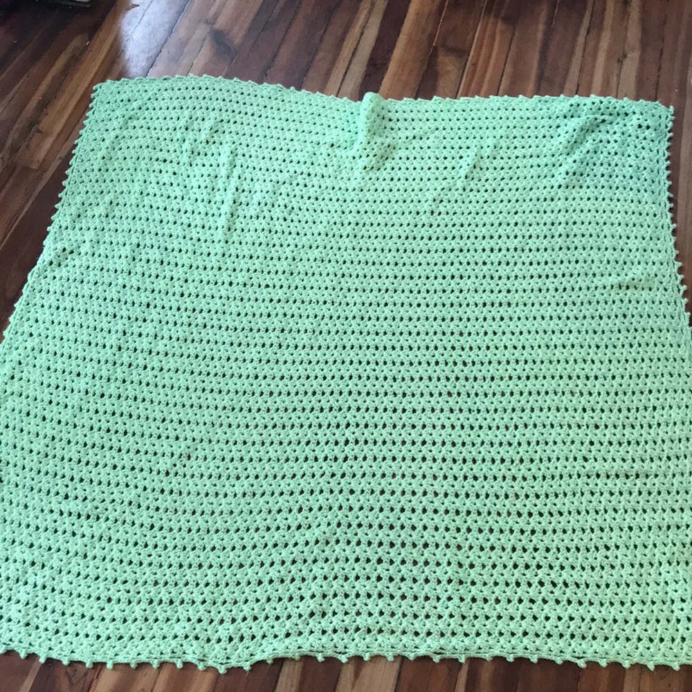 Hand-crocheted open-knit baby blanket
